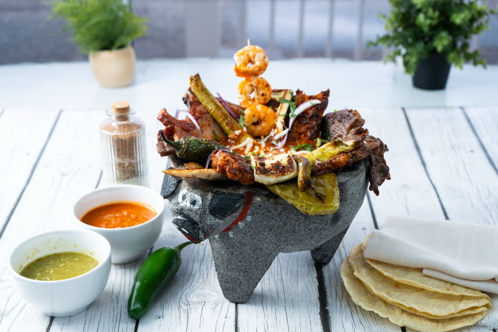 Steak, chicken, chorizo and shrimp molcajete at Villas Pueblita Mexican Restaurant in Indianapolis, IN